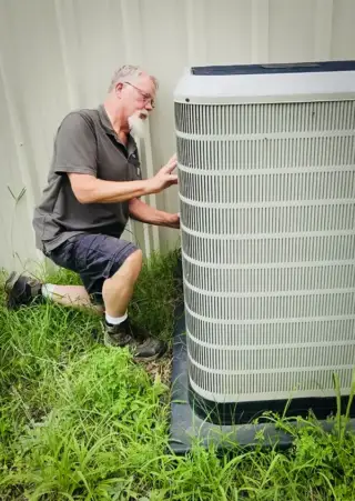 Lynn Solida, the owner of SS&L Heating & Air, providing personal service for a customer.